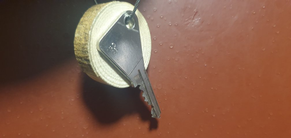 Key hung on wood with Locksmith Bedminster